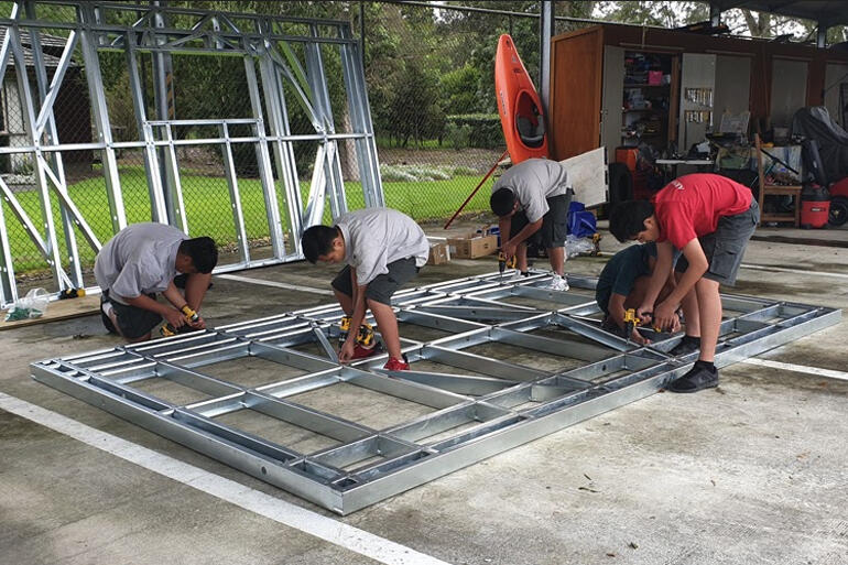 Dilworth Year 9 students begin work on the foundation structures for the sleepout building project.