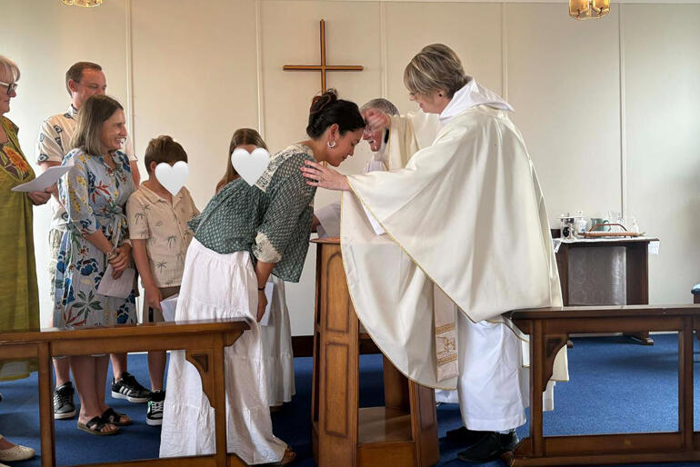 Rev Sarah Lea West baptises three new believers on Easter Day at St Andrew's by the Sea, Waiheke Island.