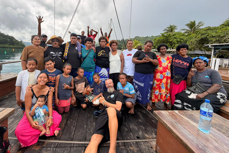In Fiji the Sail for Hope crew stretch out for a group photo with visiting church members.