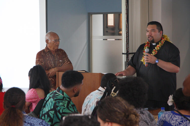 Tikanga Toru Youth Commissioner Rev Chaans Tumataroa introduces Archbishop Emeritus Winston Halapua to TYE delegates.