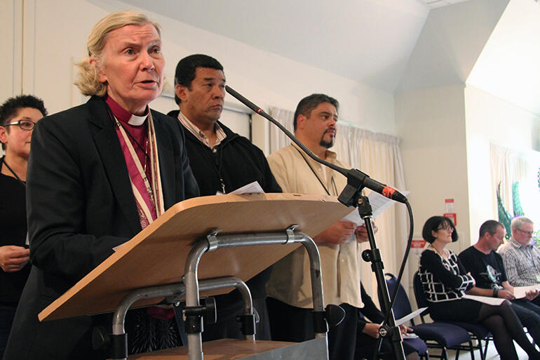 Bishop Victoria Matthews, a member of the synod working group, reads the preamble to the 'way forward' motion.