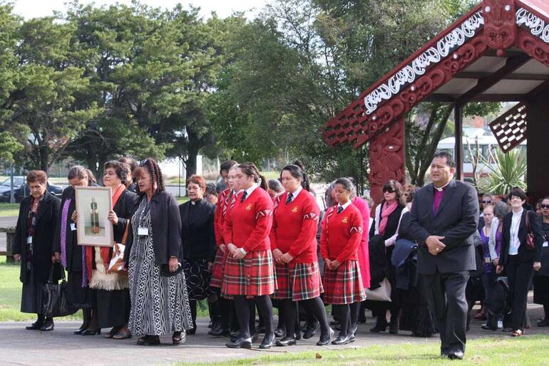 Mrs Lola Koloamatangi, of Tonga, bearing a portrait of her late diocesan bishop, the Rt Rev Jabez Bryce.