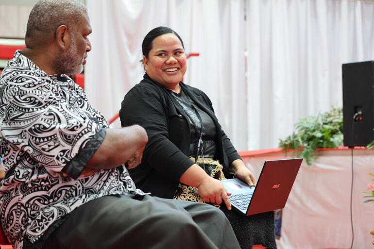 Elisiva Sunia and Rev Winston Tarere celebrate as the climate resilience motion passes with accalamation.