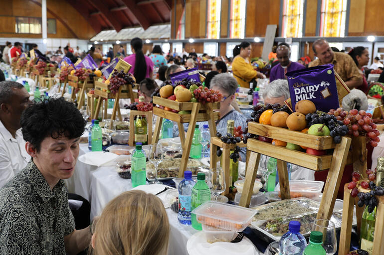 Tables groan under the weight of Tonga Episcopal Unit parishes' hospitality.