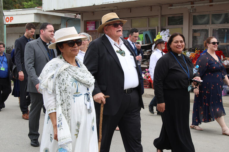 Sir Selwyn Parata joins the procession with fellow members of Te Hīnota Whānui.