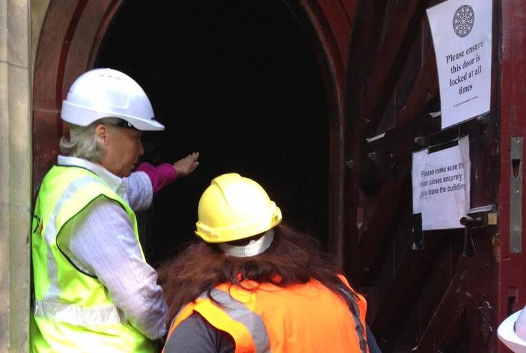 Bishop Victoria and Acting Dean Lynda Patterson enter the cathedral through a back door.