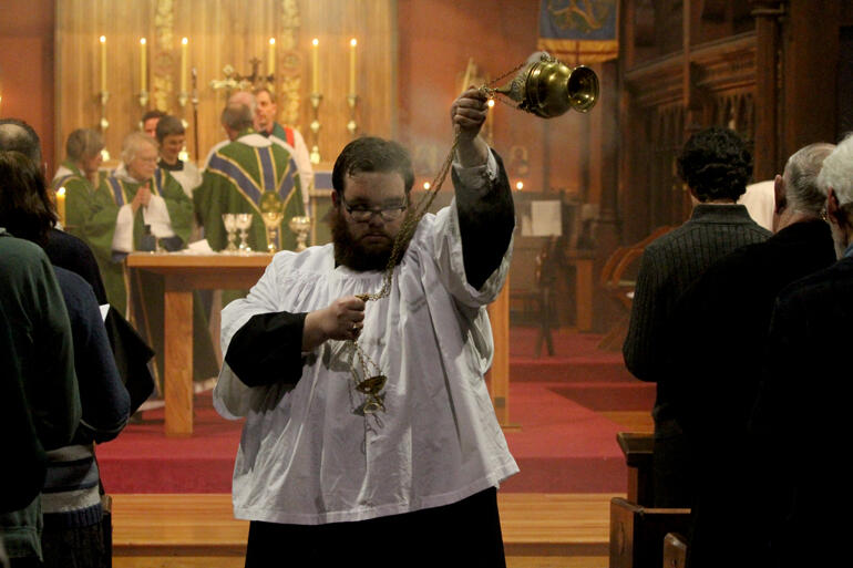 St Michael and All Angels' thurifer Jack Barrie smokes out the Hui's opening mass.