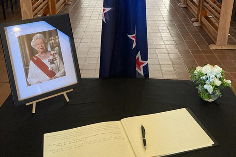 A memorial table for Her Late Majesty Queen Elizabeth II greets mourners visiting the Wellington Cathedral of St Paul.