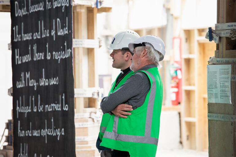 Artist Pete Majendie and  Dean of Christchurch Very Rev Ben Truman discuss Pete's Gospel canvases.