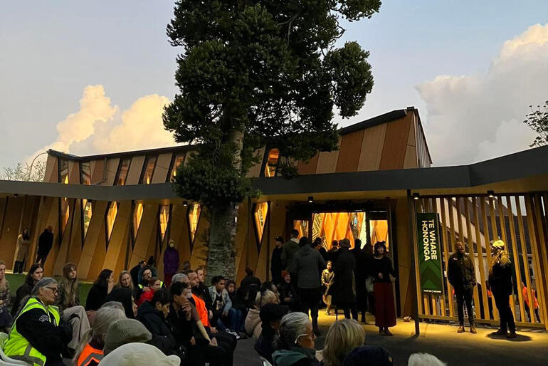 Te Whare Hononga, 'The House that Binds' stands in the dawn light on its opening day last week.