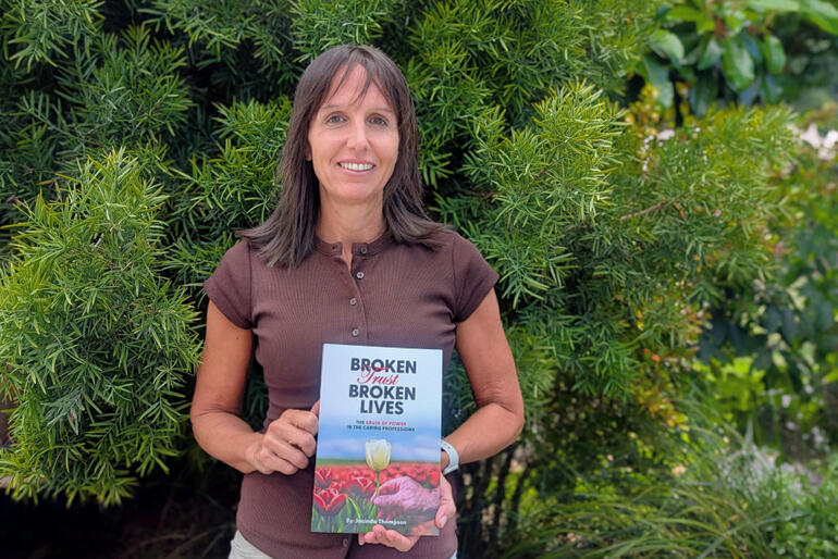 Author Jacinda Thompson with a copy of her newly published book, 'Broken Trust, Broken Lives', Real NZ Books, Nelson, 2026.