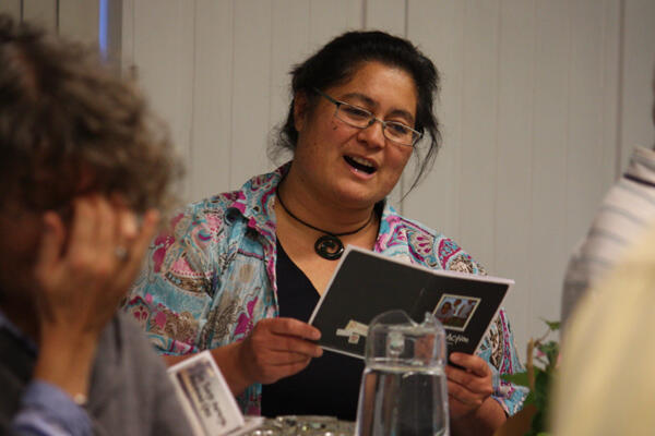 Huia Swann, who represented Tikanga Maori at the consultation, shares a reading during evening worship. 