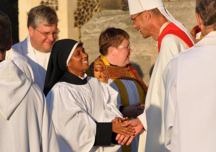 The Bishop of Kingston, Dr Richard Cheetham, congratulates Sr Veronica. Kingston is an episcopal area within the Diocese of Southwark.