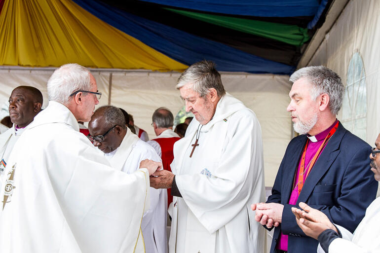 Archbishop of Canterbury Most Rev Justin Welby administers communion to Bishop John Osmers at ACC-16 in Lusaka, 2016