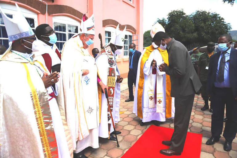 Bishop John Osmers joins fellow Zambian bishops greeting President of Zambia Edgar Lungu at the Bishop John Osmers Building opening, 2021.