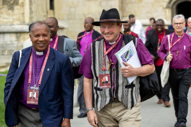 Bishop of Dunedin Rt Rev Steven Benford chats with a fellow English-speaking bishop heading into the Lambeth conference. 