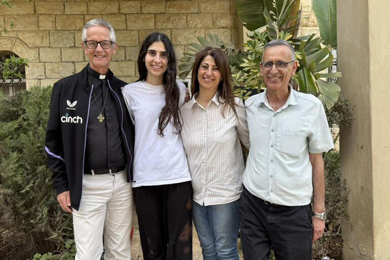 Dean Richard Sewell celebrates the return of Layan Nasir with her parents Lulu Aranki Nasir and Sami Nasir in Birzeit this week.