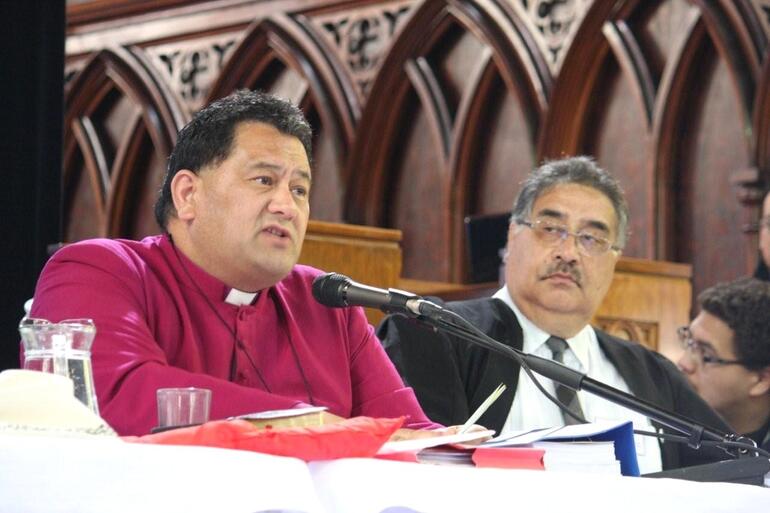 Bishop Kito Pikaahu chairs a session, with Charles Hemana at his side