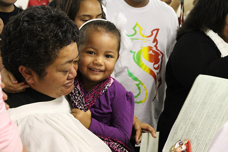 April Taylor, who was commissioned as a Kai Karakia, with a young supporter. April Taylor, who was commissioned as a Kai Karakia, with a young supporter.