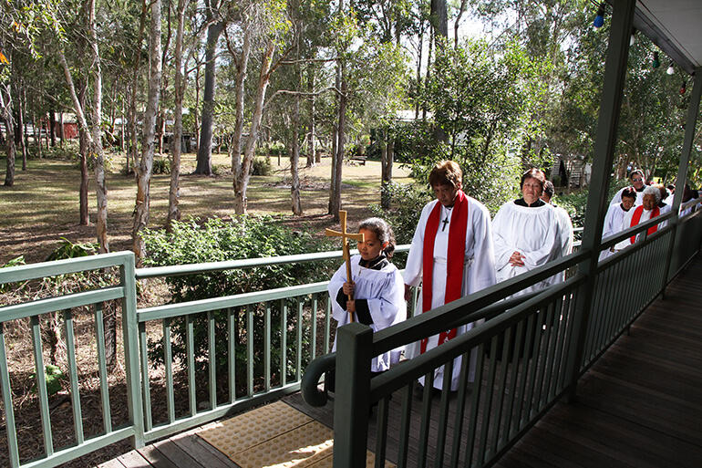 The clergy process up the ramp into Te Rau Oriwa, led by the crucifer, Kaya Walker-Grace Gray, and The Rev Erroline Anderson. The clergy process up the ramp into Te Rau Oriwa, led by the crucifer, Kaya Walker-Grace Gray, and The Rev Erroline Anderson.