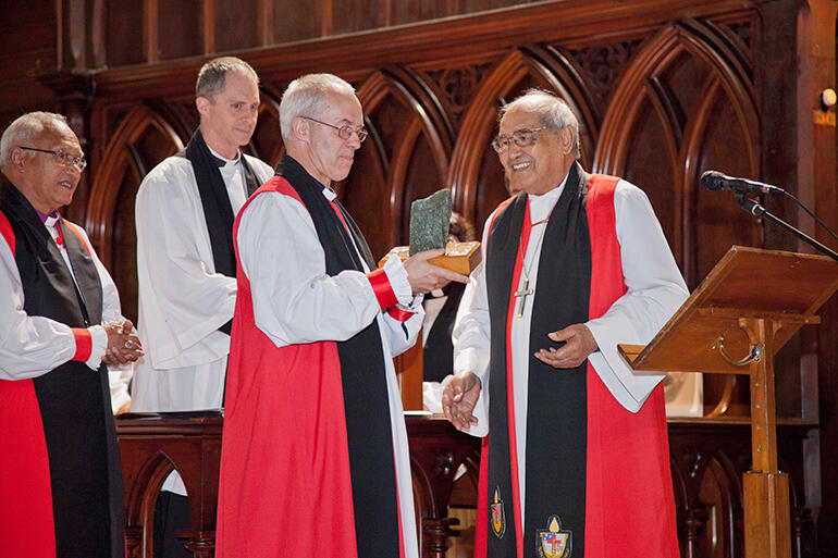 Archbishop Brown Turei presents Archbishop Welby with a gift of pounamu, or precious New Zealand jade, mounted on a plinth.