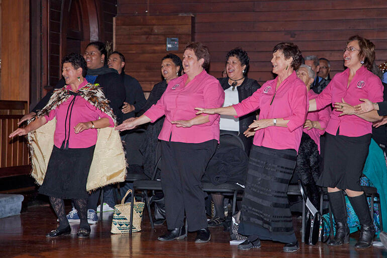 Some members of the Auckland Anglican Maori Club performing an action song.