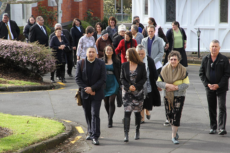 The new dean and his party being called on to the powhiri and his installation at St John's College.