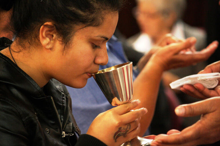 Ashley McLeod makes her communion.