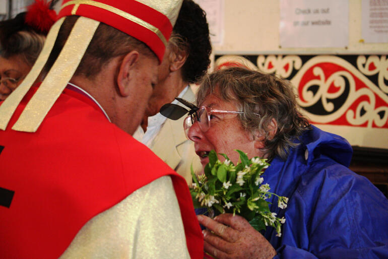 Bishop John Gray in an animated conversation with a churchgoer. Bishop John Gray in an animated conversation with a churchgoer.