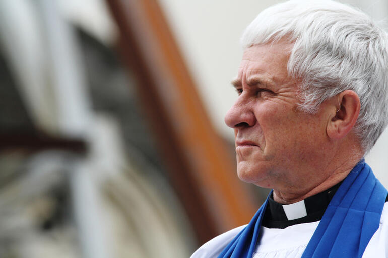 Dean Peter Beck tells the outdoor congregation that the service will "lift the tapu" on the cathedral.