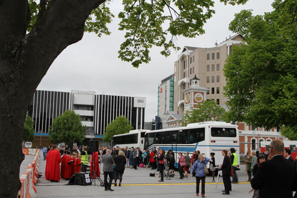 The first buses arrive for the deconsecration service.