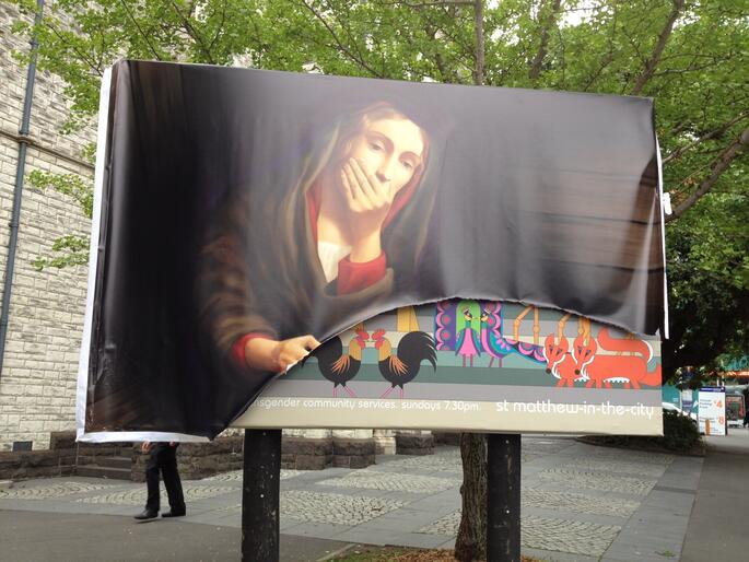 Vandalised billboard outside St Matthew-in-the-City.