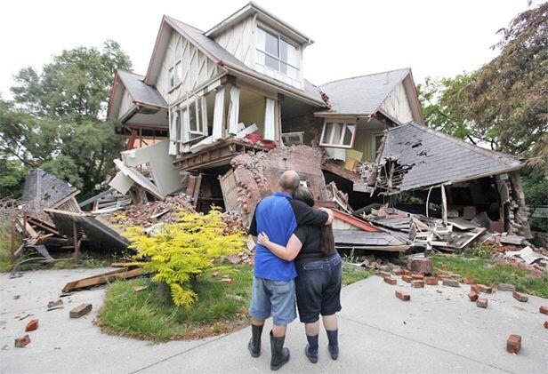 Murray and Kelly James survey the damage to their house in central Christchurch. Photo: AP.