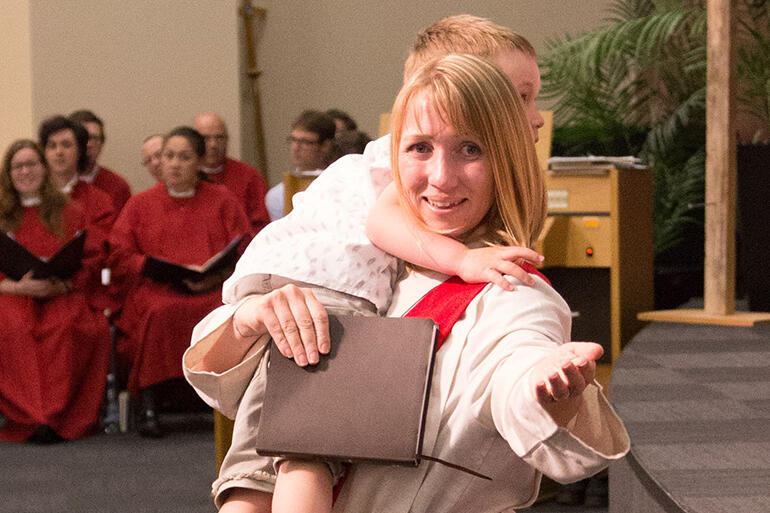 "Come! Join us!" That's the Rev Amy Houben from St Peter's Palmerston North. Her son Oran presented her with a Bible. 