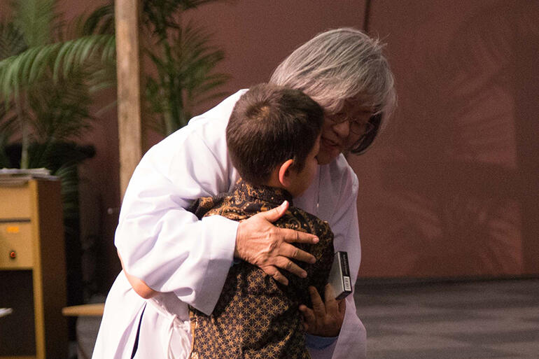 That's Carmen Yeoh, who is now a deacon in the parish of Titahi Bay, with her grandson, Jeffery Fountain.