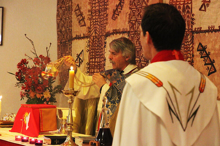 Fr Mark Beale censes the altar at the service to mark 25 years of ministry at St Elizabeth's Clendon, in South Auckland. Fr Mark Beale censes the altar at the service to mark 25 years of ministry at St Elizabeth's Clendon, in South Auckland.