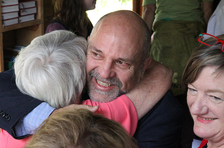 Hugh Kemp rejoices with Lesley Ayers. Lesley was one of the large crew who came from All Saints Palmerston North. 