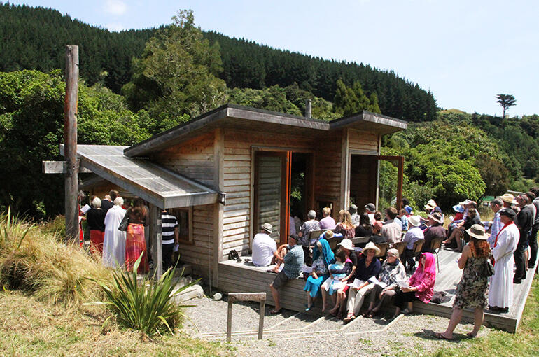 The overflow crowd of wellwishers - perhaps 130 turned up - wait for the service to begin.