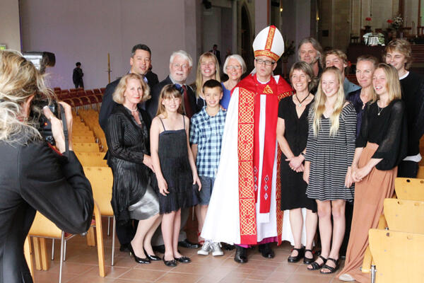 Bishop Jim with his extended family. Jane is beside him, next to their daughter Sophie. Samuel is at the back, far right.