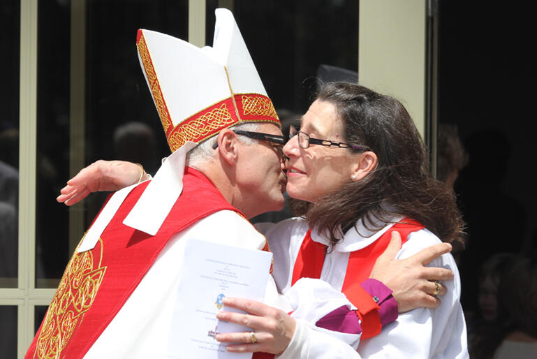 The Rev Lucy Nguyen, Vicar of St Peter's Pakuranga, greets the new bishop. Lucy is a St John's College graduate.