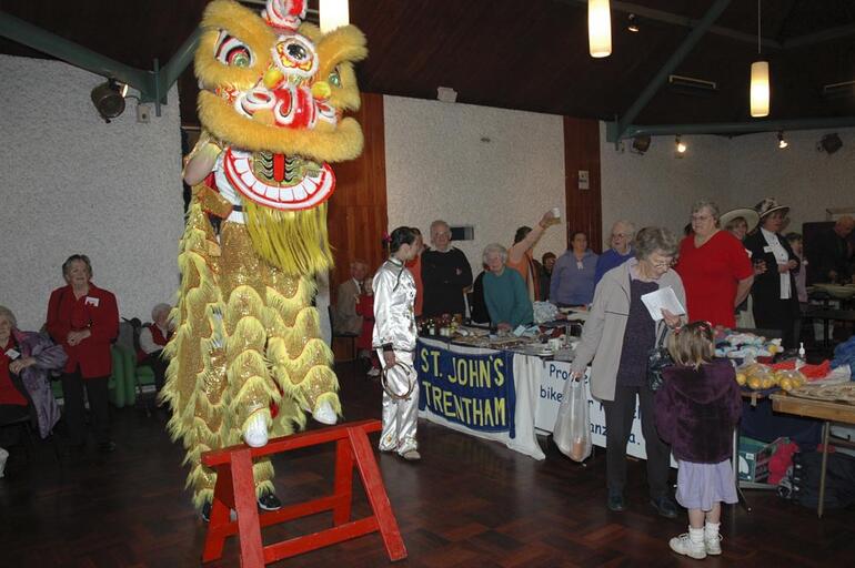 Wellington's sesqui crowd is entertained in the Loaves and Fishes.