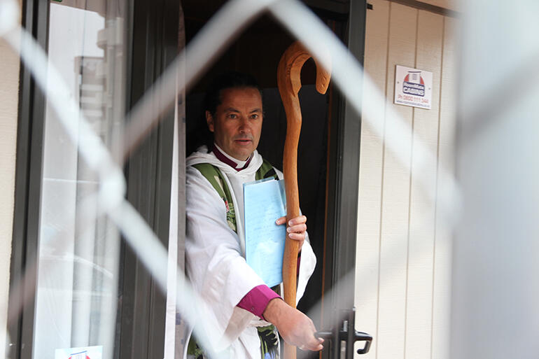 Bishop Justin emerges from his cell to lead a midday cathedral Eucharist.