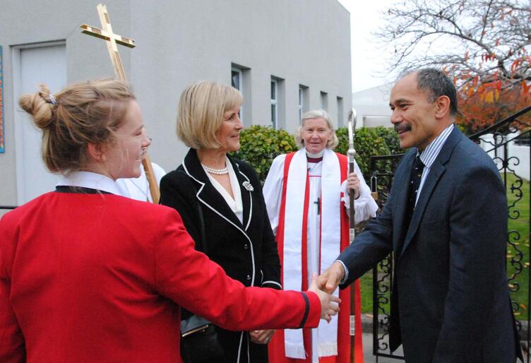 Head girl Gussie Cohen and principal Gillian Simpson greet the Governor-General, as Bishop Victoria waits to extend an episcopal welcome.