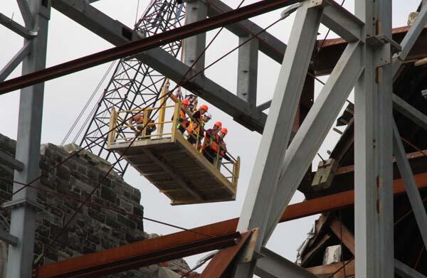 A group of our high-flying bishops peer into the ruined depths of ChristChurch Cathedral. 