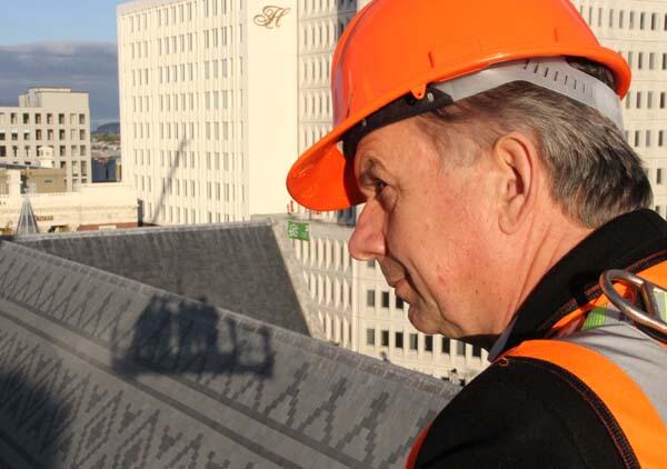 Archbishop David Moxon surveys the nave roof of ChristChurch Cathedral during a bishops' high-flying tour of the red zone.