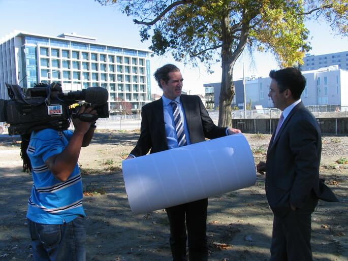 Johnny McFarlane, Project Manager for BECA, with one of the cardboard tubes that will form the cathedral walls.