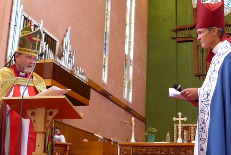 Archbishop Philip Richardson leads prayers of release for Bishop David Rice.