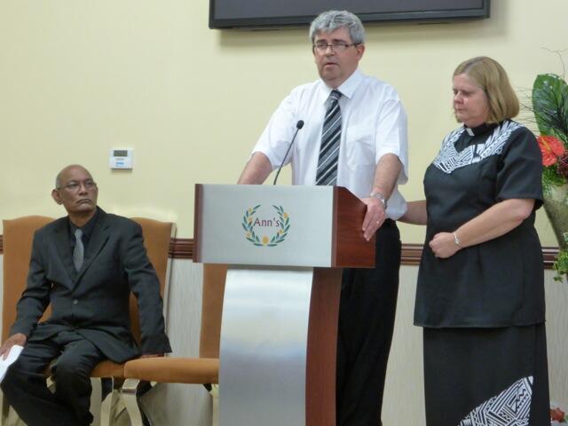 Glenn and Sandy Williams pay tribute to Dee, as funeral director Sam Achary listens.