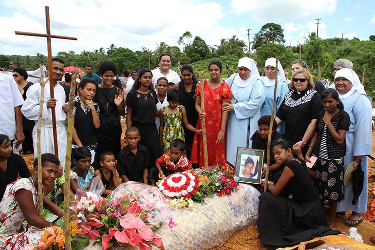 Deepika's friends and family gathered at her graveside. Deepika's friends and family gathered at her graveside.