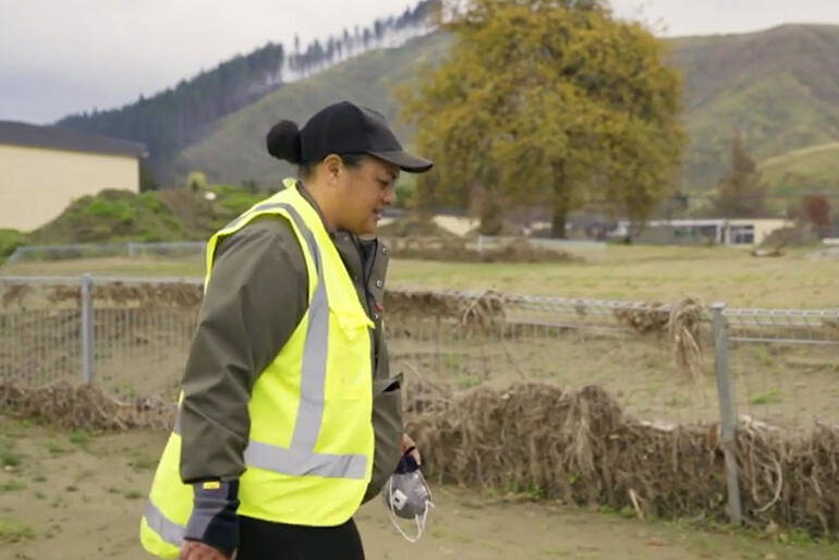 Amelia Kaui walks across the silt strewn fields at Hukarere, just as she had walked to check the Esk River on 13 February 2023.